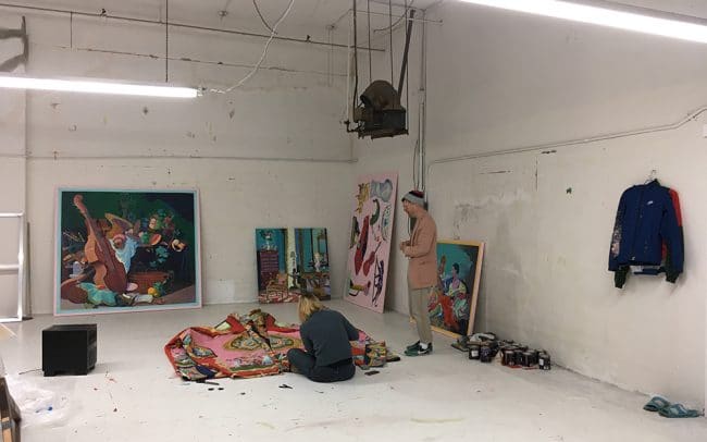 Photograph of Canadian artist Andy Dixons studio in downtown Los Angeles producing large jacket with his studio assistant