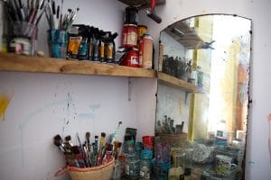 Picture of the interior of artist David Shillnglaw's studio in margate showing paints and paintbrushes