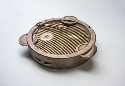 Amba Sayal Bennett – Delphian Gallery Bronze sculpture of a drum by Ambal Sayall Bennett at the Delphian Gallery exhibition